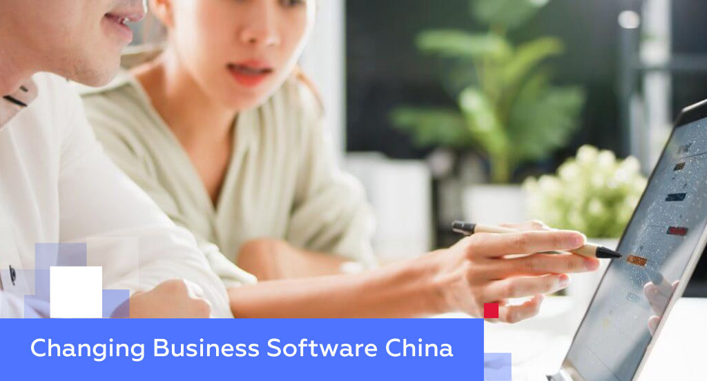 Two professionals studying data on a tablet — illustrating changing business software in China