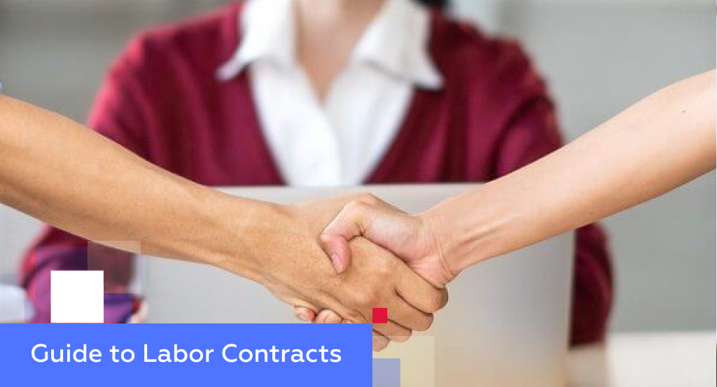 Two professionals shaking hands across a desk — illustrating a comprehensive guide to labor contracts in China