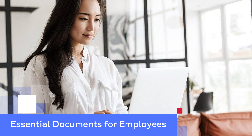 Asian businesswoman in a white blouse working on a laptop — illustrating essential documents for employees in China