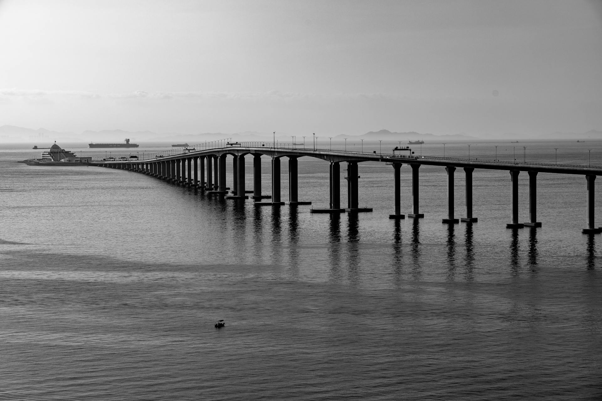 Hong Kong-Zhuhai-Macao Bridge stretching across the Pearl River Estuary connecting Hong Kong to mainland China — illustrating WFOE vs Hong Kong company comparison