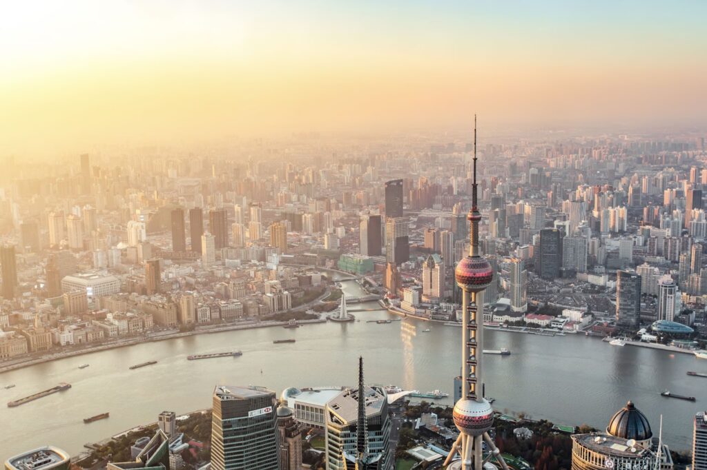 Aerial sunset view of Shanghai’s Pudong with the Oriental Pearl Tower and Huangpu River — hero image for MSA Asia’s China advisory services